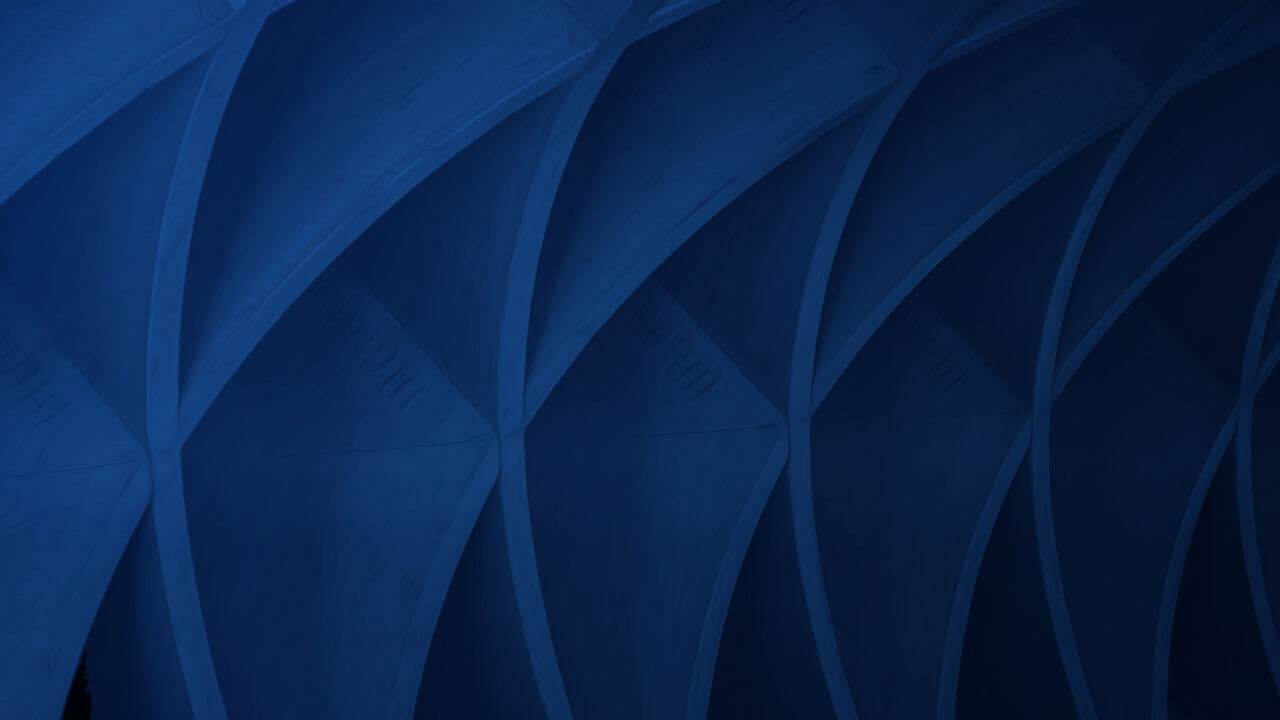 Close-up of architectural blue curves and arches creating a textured pattern.
